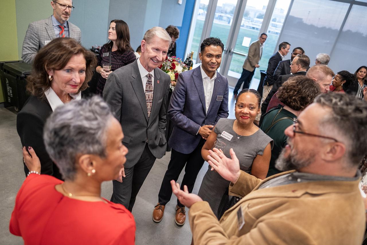 President Ted Carter talking in a group of professionals